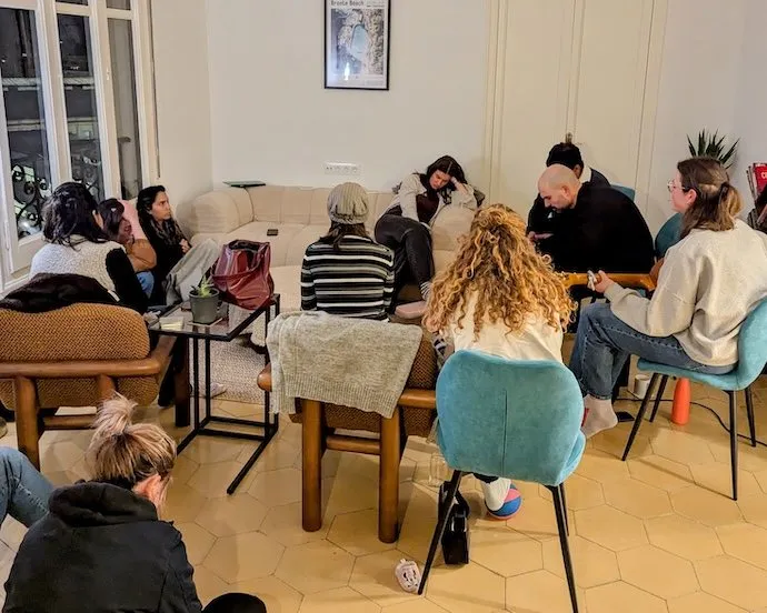 A small group talking through the Bible together in a living room